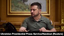 Ukraine's President Volodymyr Zelenskiy speaks with Chinese President Xi Jinping by phone in Kyiv, April 26, 2023. 