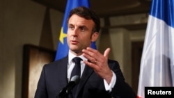 FILE - French President Emmanuel Macron makes a statement during the Munich Security Conference, Feb. 17, 2023. 