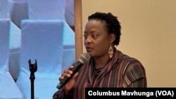 Sekai Kuvarika of the Confederation of Zimbabwe Industries addresses members of parliament in Mount Hampden, Zimbabwe, on April 22, 2024.