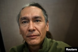 Kim Aris, the son of Myanmar’s detained former leader Aung San Suu Kyi, poses for a portrait at the Reuters office in London, Aug. 2, 2023.