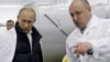 Le président russe Vladimir Poutine (à g.) et le patron de Wagner Evguéni Prigojine.