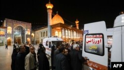 FILE - Emergency personnel transport the injured following a shooting at Iran's Shah Cheragh mausoleum in the Fars province capital, Shiraz, on Aug. 13, 2023. 