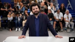 Director Saeed Roustaee poses for photographers at the photo call for the film "Leila's Brothers" at the 75th Cannes Film Festival in southern France, May 26, 2022.
