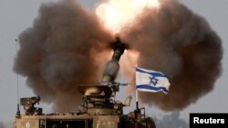 កងកាំភ្លើងធំរបស់អ៊ីស្រាអែលកំពុងប្រតិបត្តិការនៅភាគខាងត្បូងប្រទេសនៃព្រំដែនជាប់តំបន់ហ្កាហ្សា កាលពីថ្ងៃទី១២ ខែធ្នូ ឆ្នាំ២០២៣។