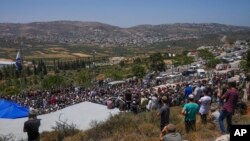 Mourners attend the funeral of Nachman Mordoff, 17, in the West Bank Israeli settlement of Shilo, June 21, 2023. Mordoff was among four Israelis killed by two Palestinian attackers near the Israeli settlement of Eli in the West Bank on Tuesday.