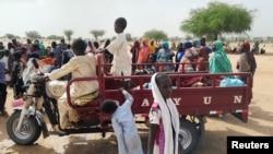 Sudanese people, who fled the violence in their country and newly arrived, are seen near the border between Sudan and Chad in Koufroun, Chad, April 27, 2023.
