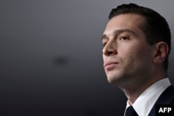 French far-right Rassemblement National (RN) political party President and lead MEP Jordan Bardella gives a speech during the results evening of the first round of the parliamentary elections in Paris, June 30, 2024.