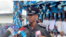In this image taken from video, Bright Edafe, the Delta state police spokesman in Nigeria, speaks to reporters after parading 67 detainees (faces blurred by source) in public in the town of Ekpan on Aug. 29, 2023. (TVC via Reuters)