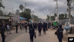 Bangladeshi police and activists of the opposition Bangladesh Nationalist Party clash in Habiganj, Bangladesh, Aug.19, 2023. The party says its leaders and activists have faced trumped-up charges under the government's security law. 