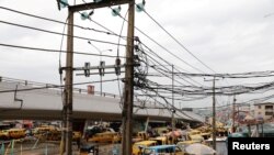 FILE - Electric wires are pictured in Ojuelegba district in Nigeria's commercial capital of Lagos, June 18, 2018. Nigerian authorities announced on April 3, 2024, a nearly 300% increase in electricity rates for some of its consumers.