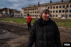 Angelina, 50, pictured April 4, 2023, says so few people are left in Siversk, Ukraine, that everyone now knows everyone else. (Yan Boechat/VOA)