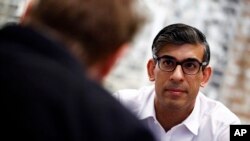 Britain's Prime Minister and Conservative Party leader Rishi Sunak meets with nighttime economy representatives in central London, June 22, 2024 as part of a campaign event in the build-up to the July 4 general election. 
