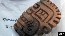Photo from Peruvian Ministry of Culture on August 26, 2023, shows a pottery piece from a 3,000-year-old priest's tomb, found by Japanese and Peruvian archaeologists in Cajamarca, Peru.
