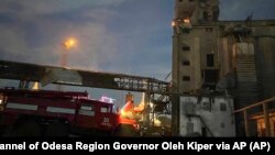 In this photo provided by regional Governor Oleh Kiper, rescuers work on a scene of drone attack in Odesa region, Ukraine, Aug. 2, 2023. (Telegram Channel of Odesa Region Governor Oleh Kiper via AP)