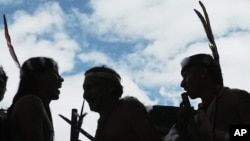 FILE - Waorani Indigenous attend an event promoting a "yes" vote in a referendum on not extracting oil in Quito, Ecuador, Aug. 14, 2023.