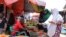 FILE - Somalis buy vegetables at a market in Mogadishu, June 12, 2022.