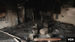 FILE - A mosque that was burnt down by Hindu rioters is seen in Delhi in Feb. 2020, during communal violence that was sparked by anti-CAA protests. (Shaikh Azizur Rahman for VOA)