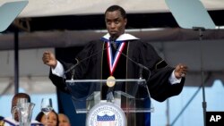 FILE - Entertainer and entrepreneur Sean "Diddy" Combs delivers Howard University's commencement speech during the school's 2014 graduation ceremony in Washington, May 10, 2014. Howard University has announced it is cutting its ties to Combs.