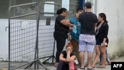 Relatives of inmates wait for information outside Medicina Legal in Guayaquil, Ecuador, on April 15, 2023, after clashes broke out in the Guayas 1 prison.