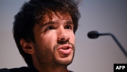 FILE - Franco-Spanish lawyer Juan Branco representing Senegalese opposition leader Ousmane Sonko speaks during a press conference in Paris on June 22, 2023. 