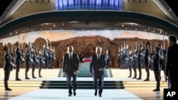 Russian President Vladimir Putin, left, and Uzbek President Shavkat Mirziyoyev visit Yangi O'zbekiston park during Putin's visit to Tashkent, Uzbekistan, May 26, 2024. (Mikhail Metzel, Sputnik, Kremlin pool via AP)