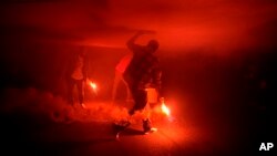 Sparks fly as Israelis protesting Prime Minister Benjamin Netanyahu's government plans to overhaul the judicial system hold an alternative Independence Day observance in Tel Aviv, Israel, April 25, 2023.