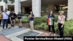 Iranian Americans protest outside Iran’s interests section office in Washington, June 28, 2024, as it hosts an absentee voter ballot station for the first round of the Iranian presidential election.