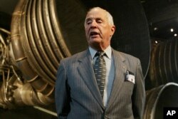 FILE - Retired Major General William Anders speaks to reporters in Washington, July 20, 2004. Anders, the former Apollo 8 astronaut who took the iconic “Earthrise” photo showing the planet as a shadowed blue marble from space in 1968, died June 7, 2024.