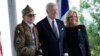 President Joe Biden and first lady Jill Biden, greet a World War II veteran during ceremonies to mark the 80th anniversary of D-Day, June 6, 2024, in Normandy. 