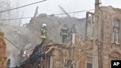 Rescuers work on the site of an apartment building destroyed by a Russian attack in Odesa, Ukraine, Dec. 29, 2023.