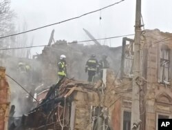 Rescuers work on the site of an apartment building damaged after a Russian attack in Odesa, Ukraine, on Dec. 29, 2023.