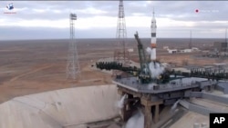 In this photo taken from video by Roscosmos, a Soyuz-2.1a rocket booster with a Soyuz MS-25 space capsule carrying a crew of three stands on its pad after its launch was aborted, at the Russia-leased Baikonur cosmodrome, in Kazakhstan, March 21, 2024.
