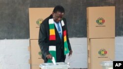 Zimbabwean President Emmerson Mnangagwa casts his vote at a polling station in Kwekwe, Zimbabwe, Aug. 23, 2023. He was re-elected for a second and final five-year term on Aug. 26, 2023.