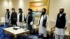 FILE - Members of the Taliban's peace negotiation team attend a meeting amid talks between Taliban and the Afghan government, in Doha, Nov. 21, 2020. Taliban says it will send a delegation to the two-day United Nations conference on Afghanistan, scheduled in Doha, June 30.