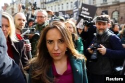 FILE - Stella Assange, the wife of WikiLeaks founder Julian Assange walks, on the day the High Court is set to rule on whether Julian Assange can appeal against extradition from Britain to the United States, in London, March 26, 2024.