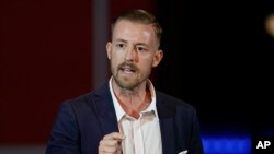 FILE - Ryan Walters speaks at a rally in Oklahoma City, Nov. 1, 2022. Walters, who is Oklahoma's top education official, has ordered public schools to incorporate the Bible into lessons for students in grades 5 through 12.