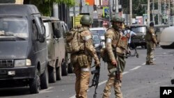 Russian servicemen guard an area in a street in Rostov-on-Don, Russia, June 24, 2023.