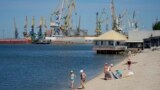 Local residents relax on a city beach in Berdiansk, a region under Russian military control, southeastern Ukraine, June 14, 2022. (AP Photo)