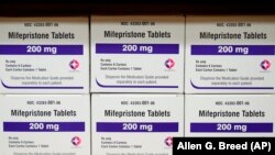 FILE - Boxes of the drug mifepristone sit on a shelf at the West Alabama Women's Center in Tuscaloosa, Ala., on March 16, 2022.