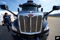 A self-driving tractor trailer is displayed at a test track in Pittsburgh, Thursday, March 14, 2024. (AP Photo/Gene J. Puskar)