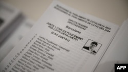 Carles Puigdemont's Junts per Catalunya (Together for Catalonia) separatist party list is pictured at a polling station in La Roca del Valles on May 12, 2024, during Catalonia's regional elections. 