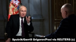 ปธน.วลาดิเมียร์ ปูติน แห่งรัสเซีย กล่าวระหว่างการให้สัมภาษณ์กับ Rossiya Segodnya media group ที่กรุงมอสโก รัสเซีย 12 มี.ค. 2024 (Sputnik/Gavriil Grigorov/Pool via REUTERS)