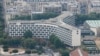 FILE - A photograph taken from the top of the Eiffel Tower shows an aerial view of Paris, with the UNESCO headquarters building, July 15, 2020.