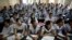 FILE - In this Aug. 5, 2010, photograph, students attend an entrance-exam class in Kota, India.