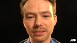 Swedish EU diplomat Johan Floderus is seen in this family handout of a screengrab taken during a video call from Evin prison in Tehran, Aug. 7, 2023. (AFP Photo/Handout)