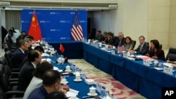 U.S. Commerce Secretary Gina Raimondo, right, speaks during a meeting with her Chinese counterpart Wang Wentao, left, at the Ministry of Commerce in Beijing, Aug. 28, 2023.