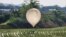 A balloon believed to have been sent by North Korea, carrying various objects including what appeared to be trash and excrement, is seen over a rice field at Cheorwon, South Korea, May 29, 2024. (Yonhap via Reuters)