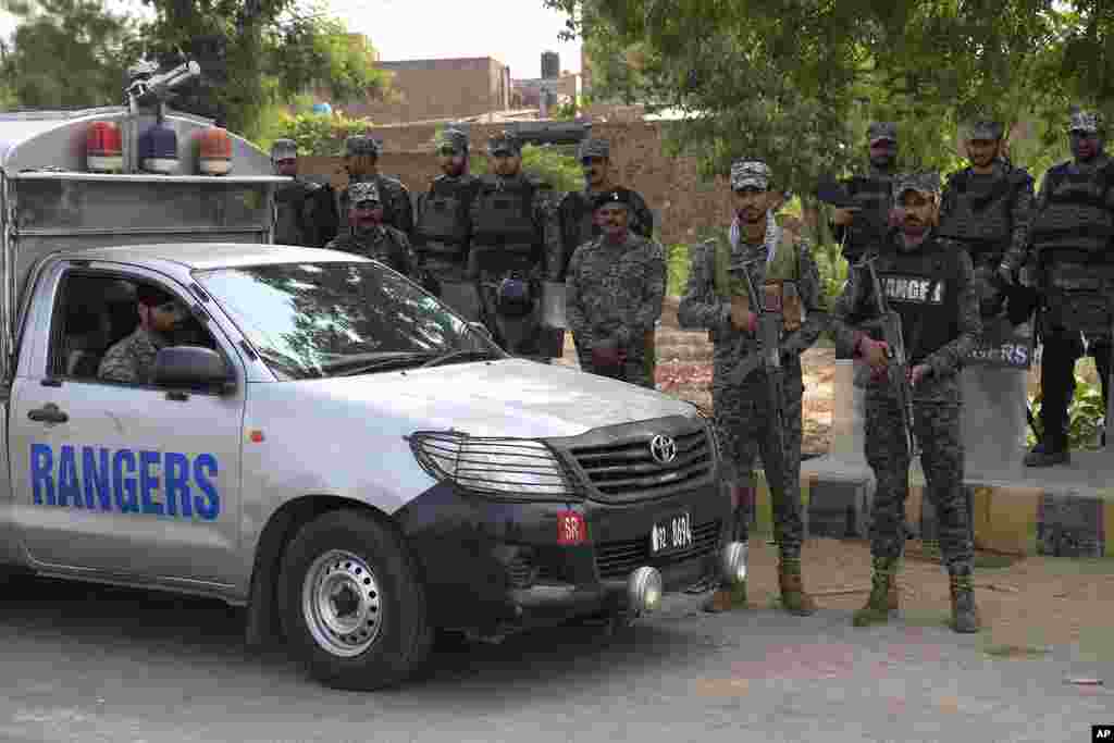 Paramilitary troops stand guard after an angry Muslim mob attacked a Christian area in Pakistan on Aug. 17, 2023. 