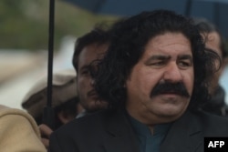 FILE - Ali Wazir, member of parliament, helps lead a protest against the detention of the chief of the Pashtun Protection Movement in Islamabad, Jan. 28, 2020. He has spoken out against a new military operation, say previous ones hurt innocent people.