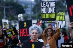 People attend a protest demanding the release of hostages kidnapped in the deadly October 7 attack on Israel by the Palestinian Islamist group Hamas from Gaza, in Tel Aviv, Israel, April 8, 2024.